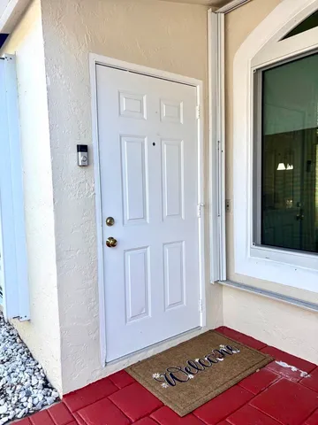 a view of a dining room with furniture and window