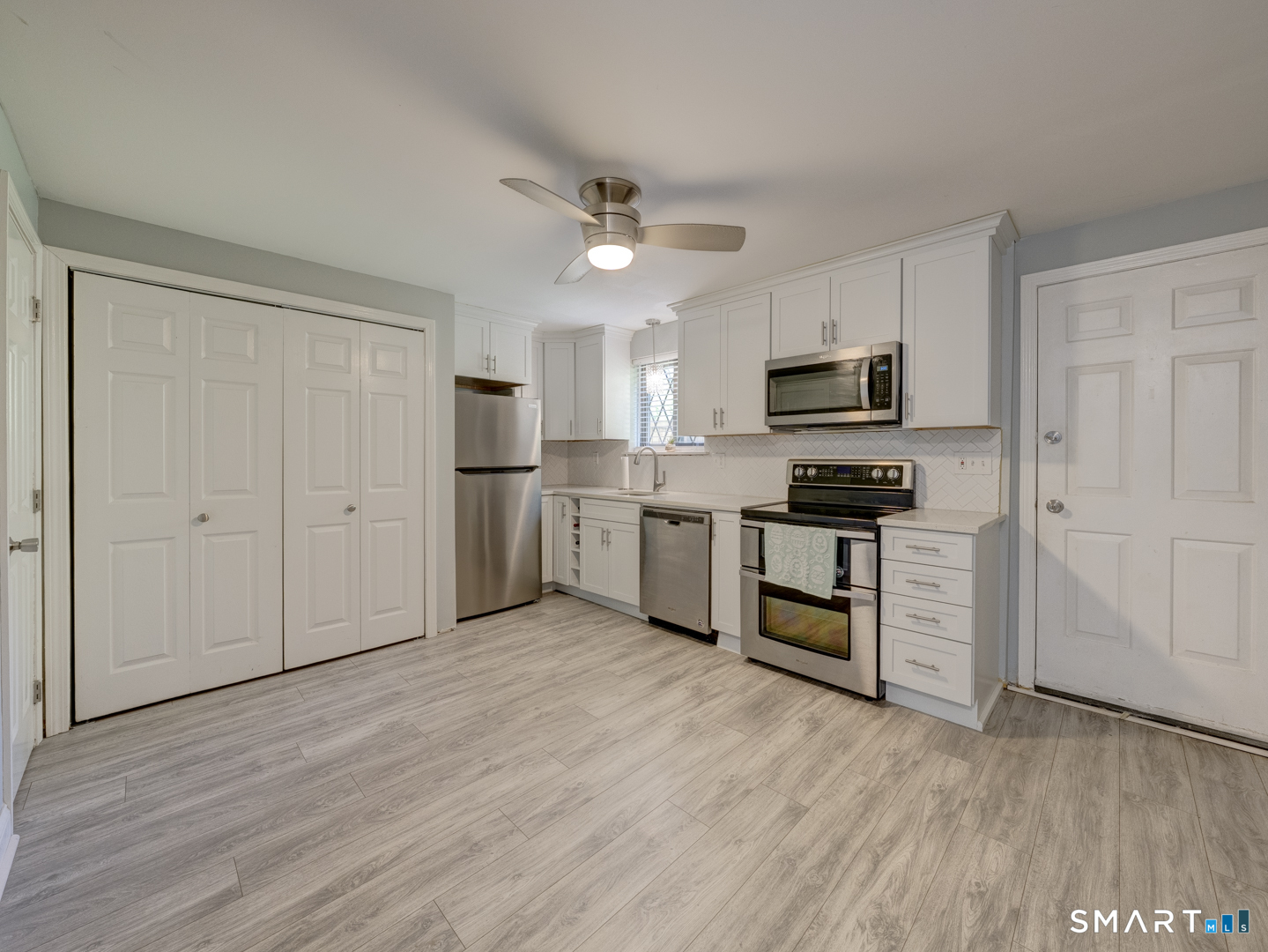 2 Branch Road, Unit 2C Thomaston, CT 06787 - Photo 6 of 26 a kitchen with a refrigerator and a stove top oven