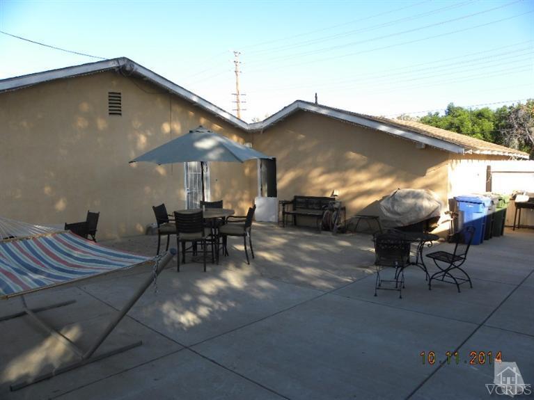 4192 Cochran Street Simi Valley, CA 93063 - Photo 14 of 17 a roof deck with table and chairs and potted plants