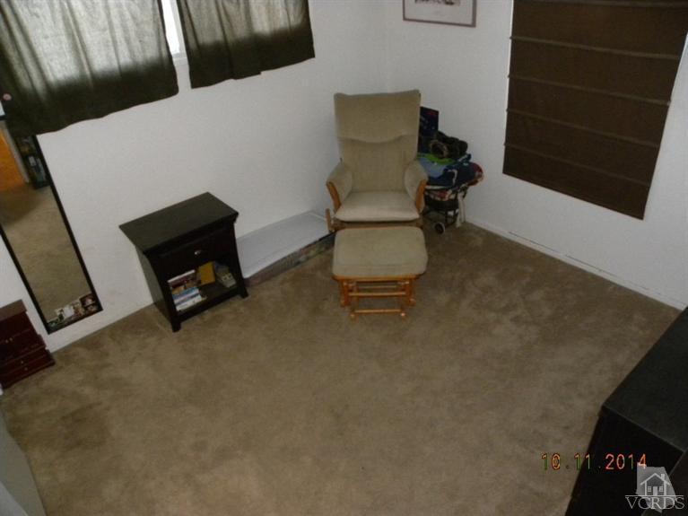 4192 Cochran Street Simi Valley, CA 93063 - Photo 8 of 17 a living room with furniture and a flat screen tv