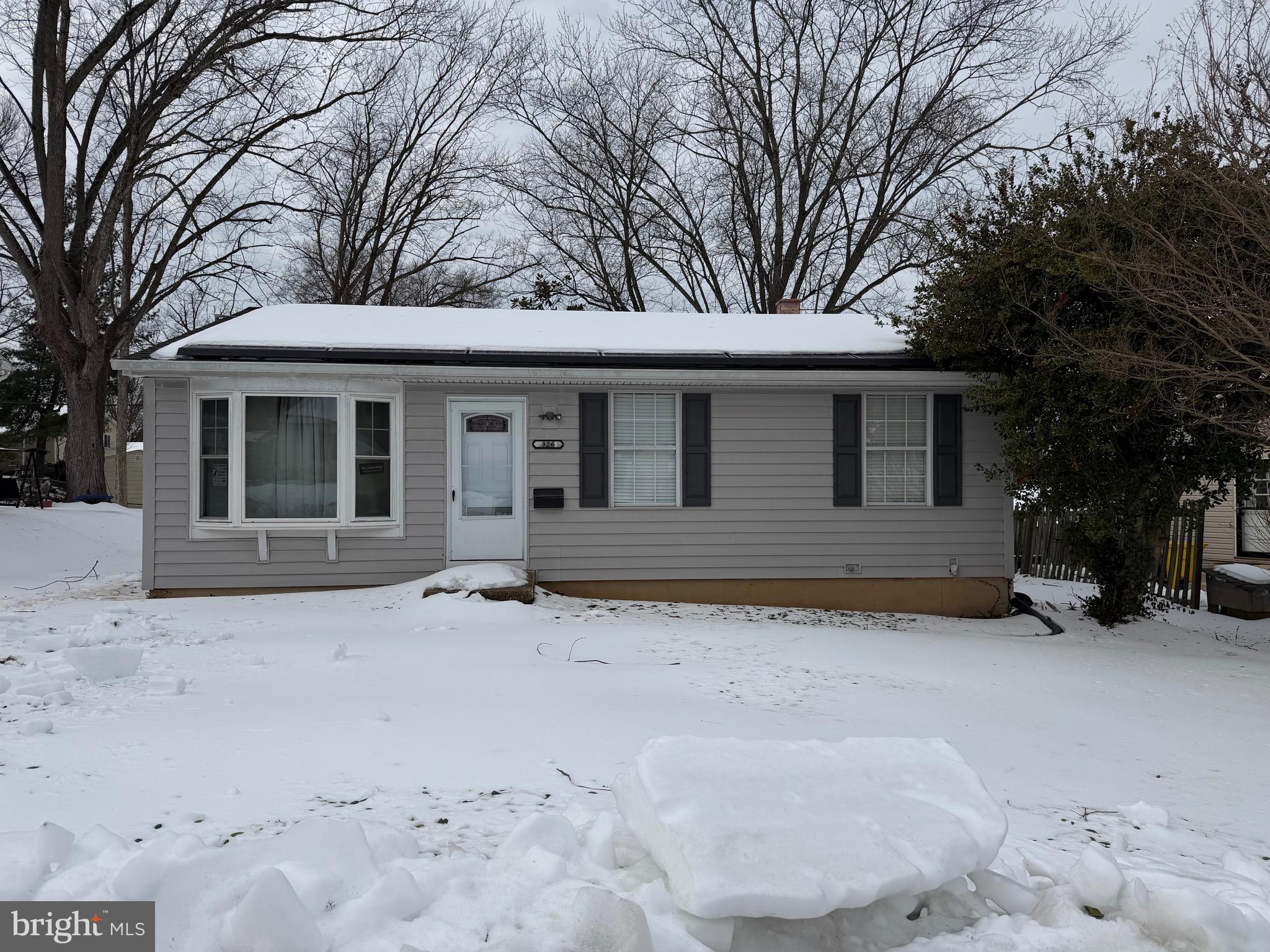 326 Ellerton South Laurel, MD 20724 - Photo 2 of 2 a backyard of a house with large trees and outdoor space