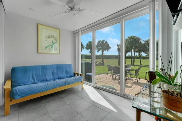 a living room with couch and a large window