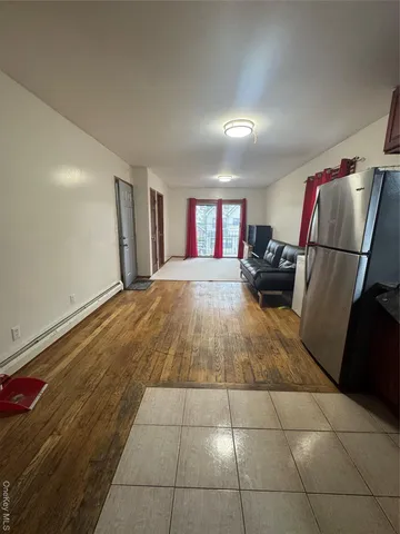 a living room with a couch and a stove top oven