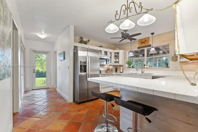 a view of a kitchen and dining area