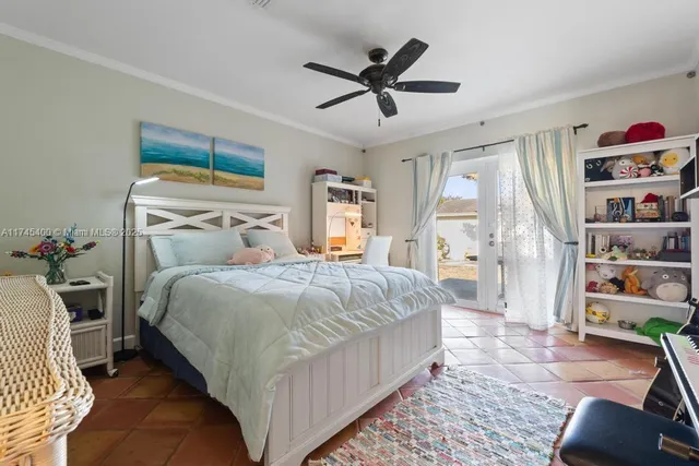 a bedroom with a bed and a book shelf