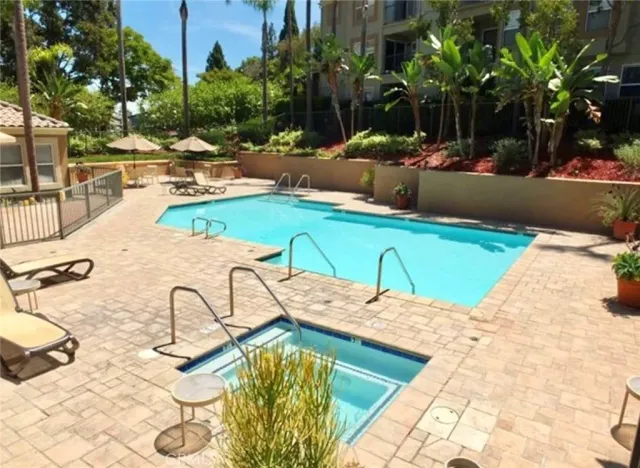 a view of a swimming pool with lounge chairs