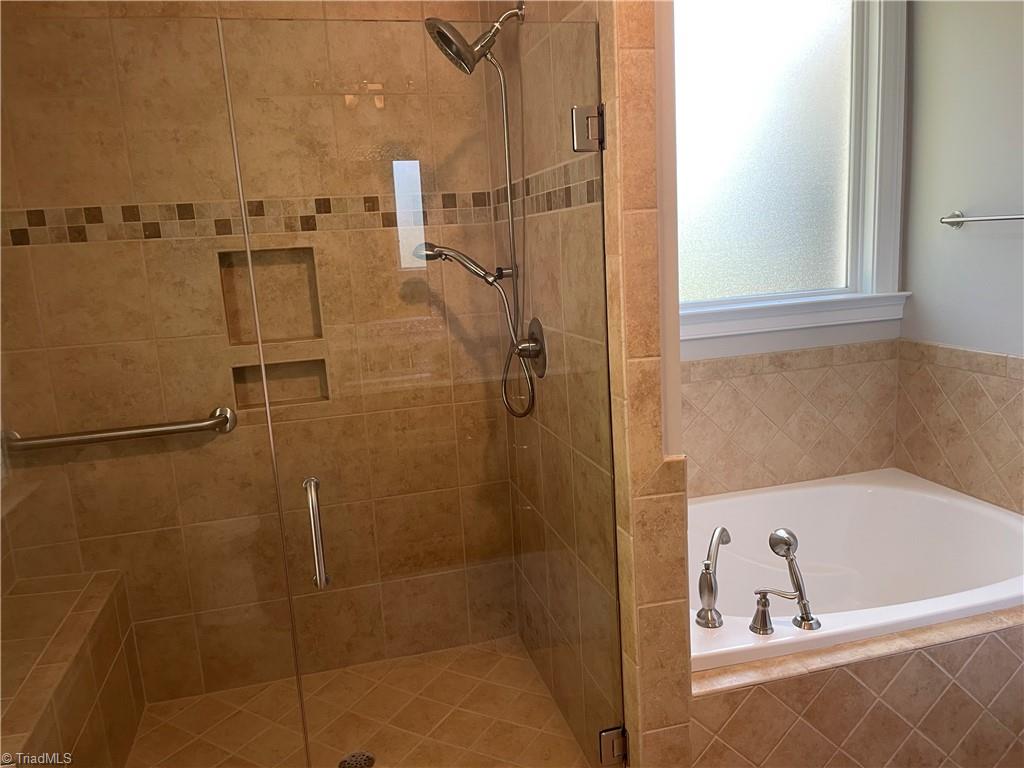 9012 Ray Road Raleigh, NC 27613 - Photo 6 of 42 Primary Bedroom Bath Pic 2; showing walk-n shower and garden tub