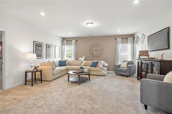 a living room with furniture and a table