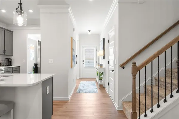 a kitchen with stainless steel appliances granite countertop a sink a stove and a refrigerator