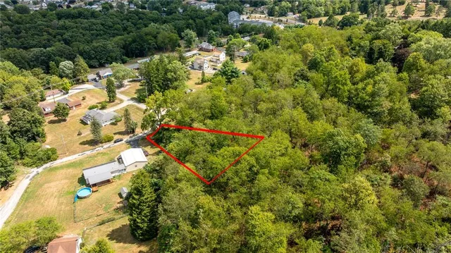 an aerial view of multi story residential houses with yard