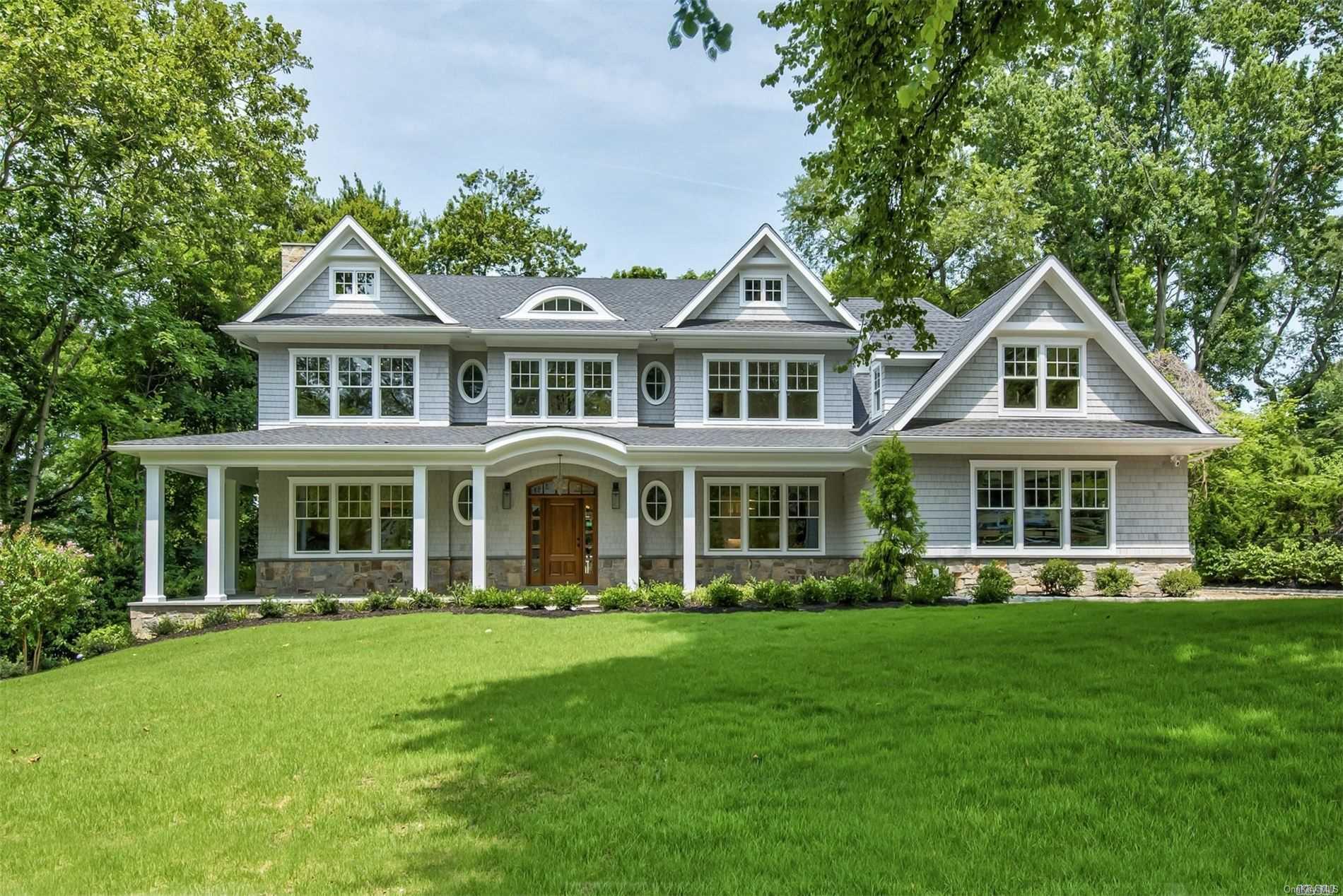4 Luquer Road Manhasset, NY 11030 - Photo 1 of 1 a front view of a house with a yard