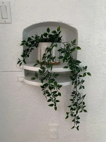 a view of a swimming pool with a yard