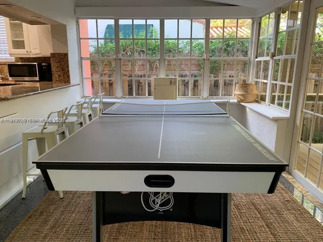 a living room with furniture window and wooden floor