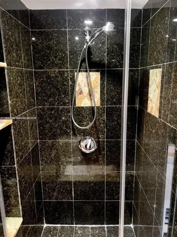 a kitchen with stainless steel appliances kitchen island granite countertop a sink and cabinets