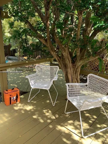 a terrace of a house with outdoor seating