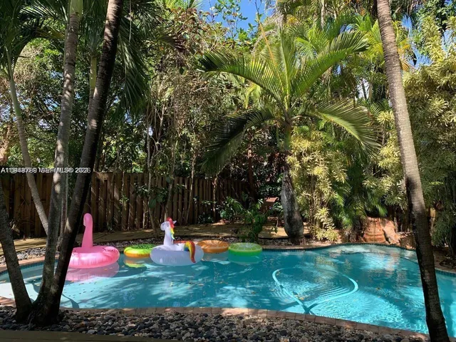 a view of a park with large trees