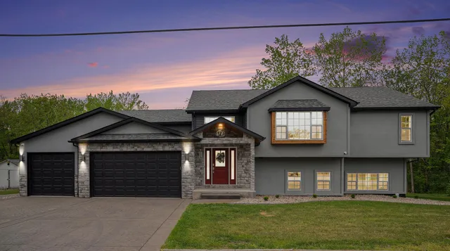 a front view of a house with a yard