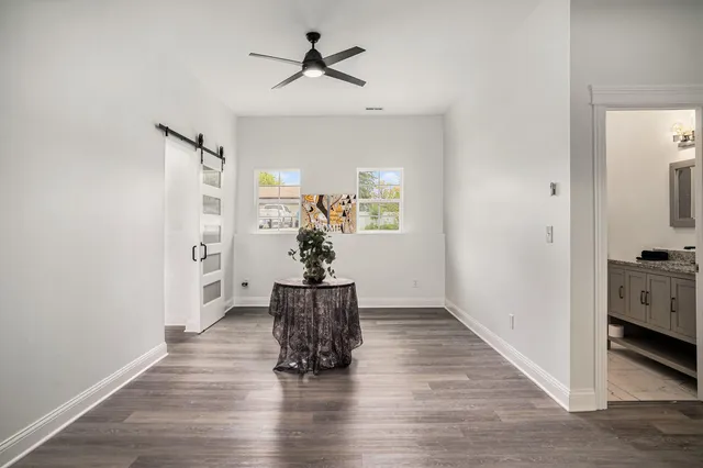a view of livingroom with hardwood floor and a ceiling fan