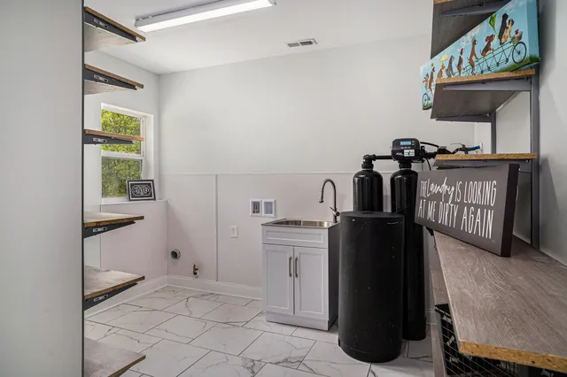 a kitchen with a refrigerator and a stove
