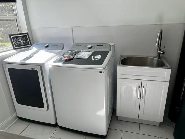 a utility room with dryer and washer