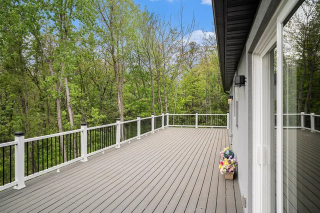 a view of a balcony with wooden floor