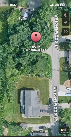 an aerial view of a house with a yard swimming pool and outdoor seating