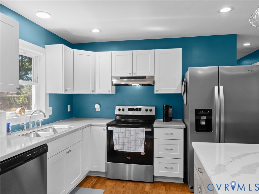 408 Howerton Road Tappahannock, VA 22560 - Photo 17 of 49 Stainless steel appliances, white shaker cabinetry