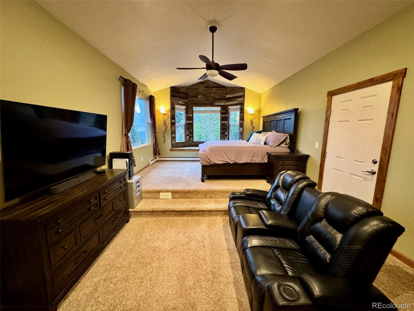 20670 Rangeview Drive Morrison, CO 80465 - Photo 22 of 39 a living room with furniture and a flat screen tv