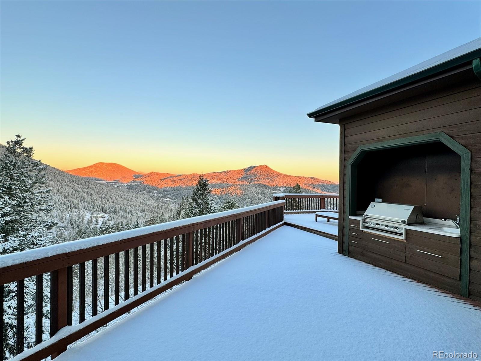 20670 Rangeview Drive Morrison, CO 80465 - Photo 32 of 39 a view of a terrace with a couple of trees