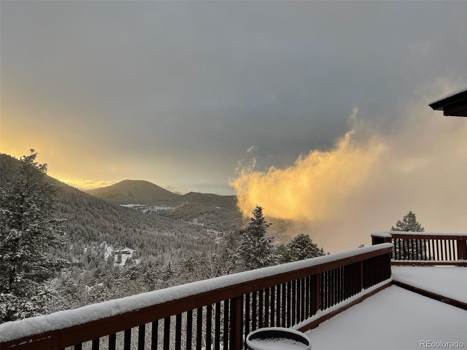 20670 Rangeview Drive Morrison, CO 80465 - Photo 37 of 39 a view of city and mountain from a balcony
