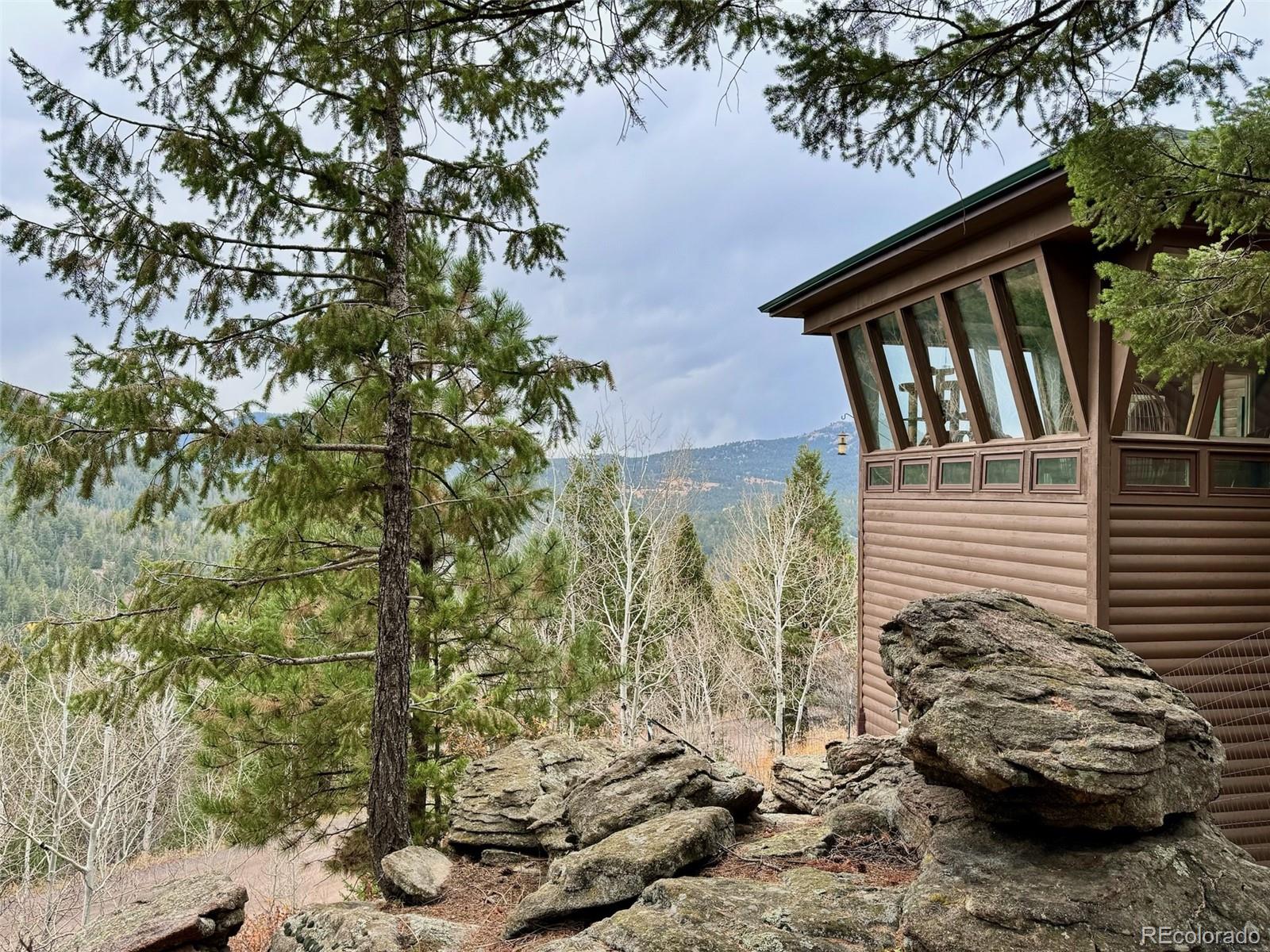 20670 Rangeview Drive Morrison, CO 80465 - Photo 5 of 39 a view of backyard of the house