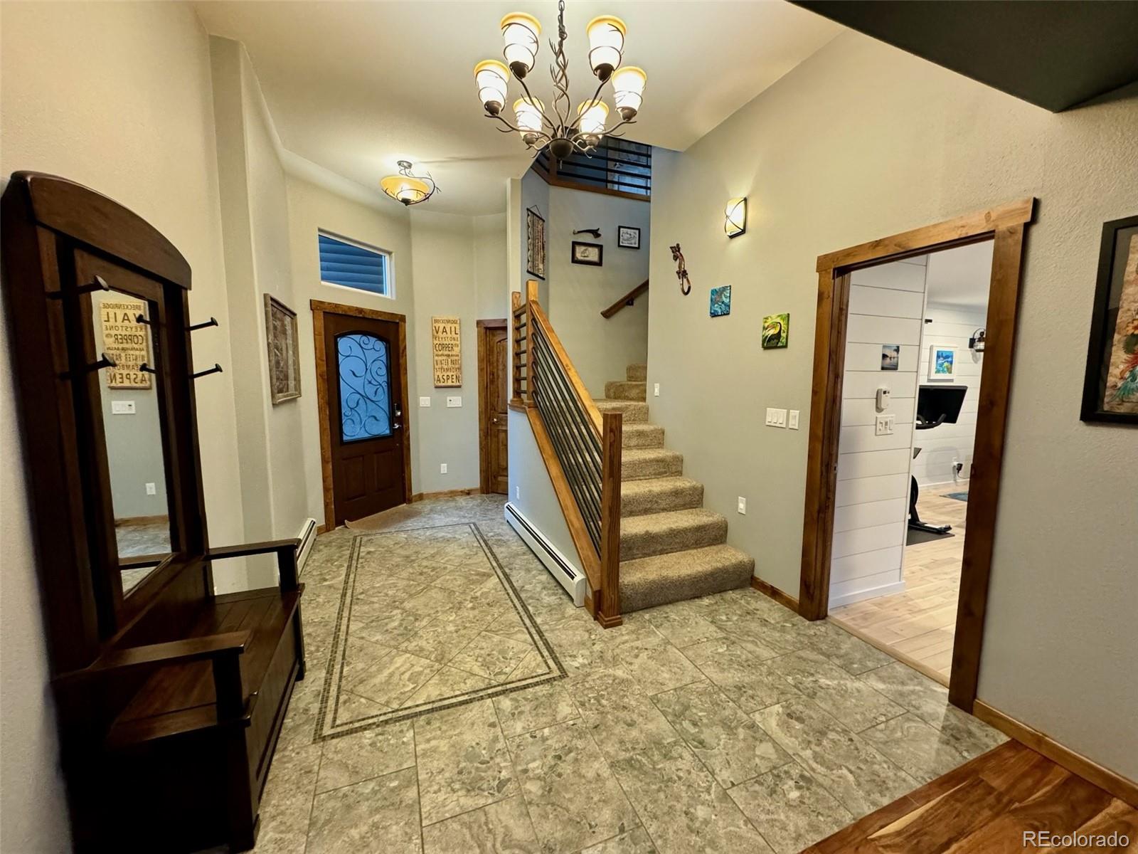 20670 Rangeview Drive Morrison, CO 80465 - Photo 8 of 39 a view of entryway with stairs and furniture