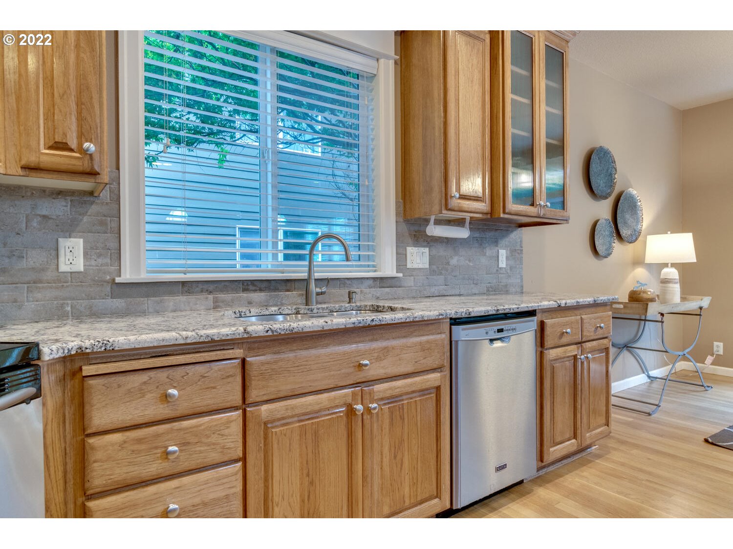 17496 Southwest 105th Avenue Tualatin, OR 97062 - Photo 12 of 28 a kitchen with a sink cabinets and window