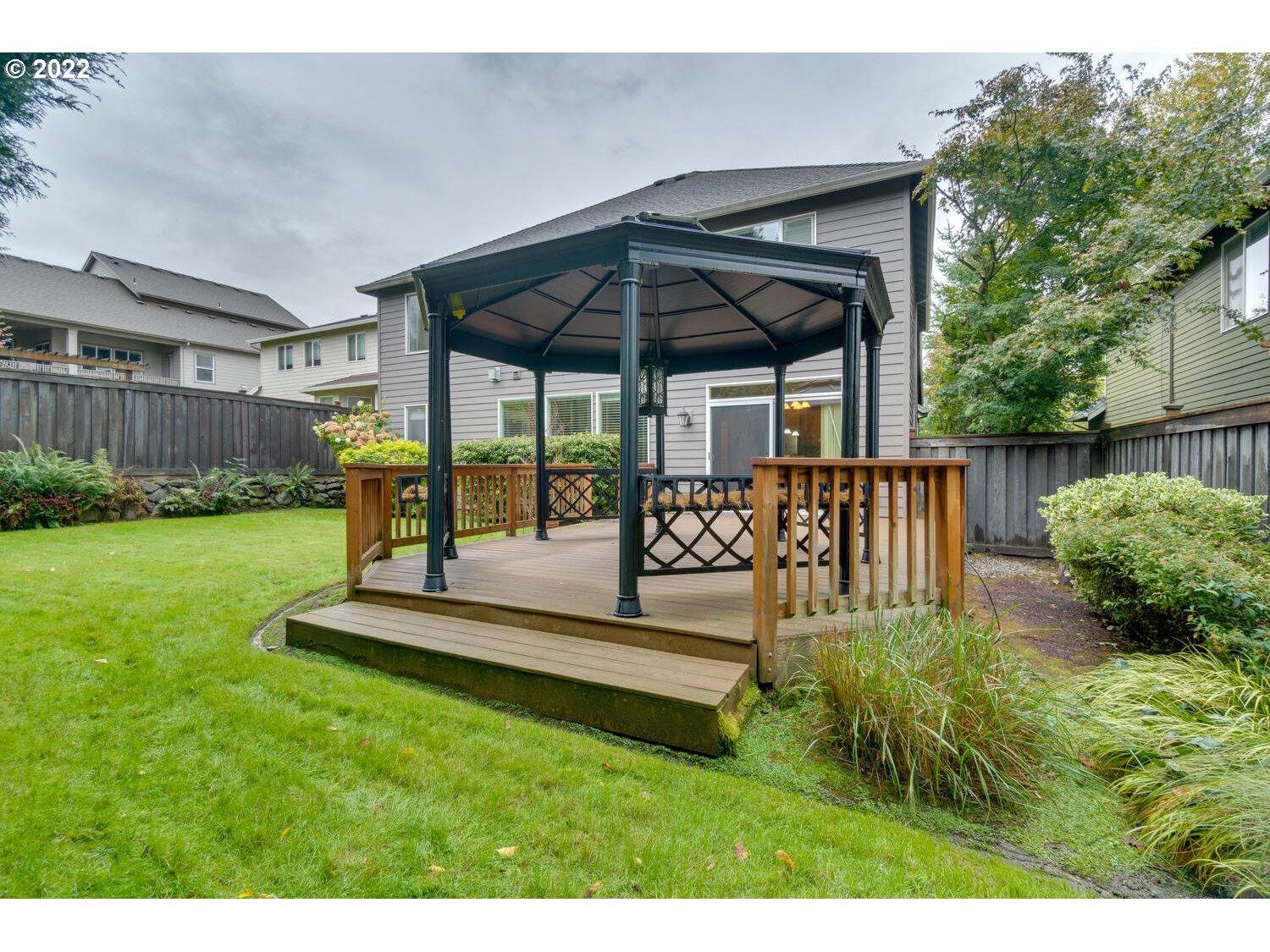 17496 Southwest 105th Avenue Tualatin, OR 97062 - Photo 27 of 28 a view of a house with backyard and sitting area