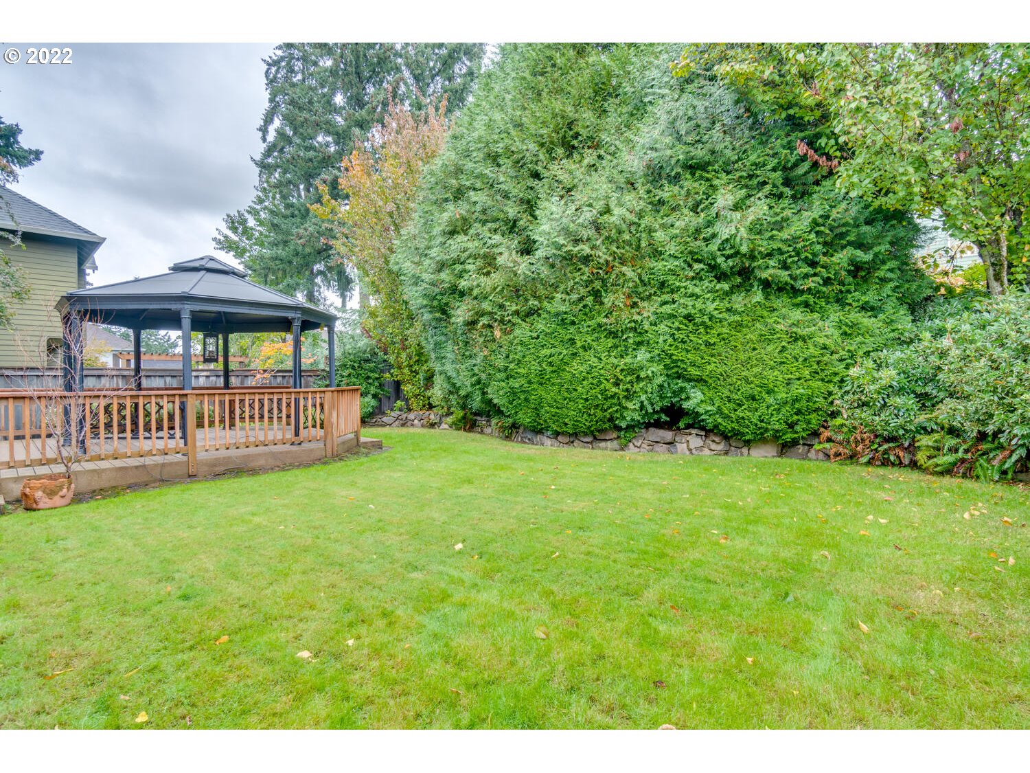 17496 Southwest 105th Avenue Tualatin, OR 97062 - Photo 28 of 28 a view of a house with backyard and garden