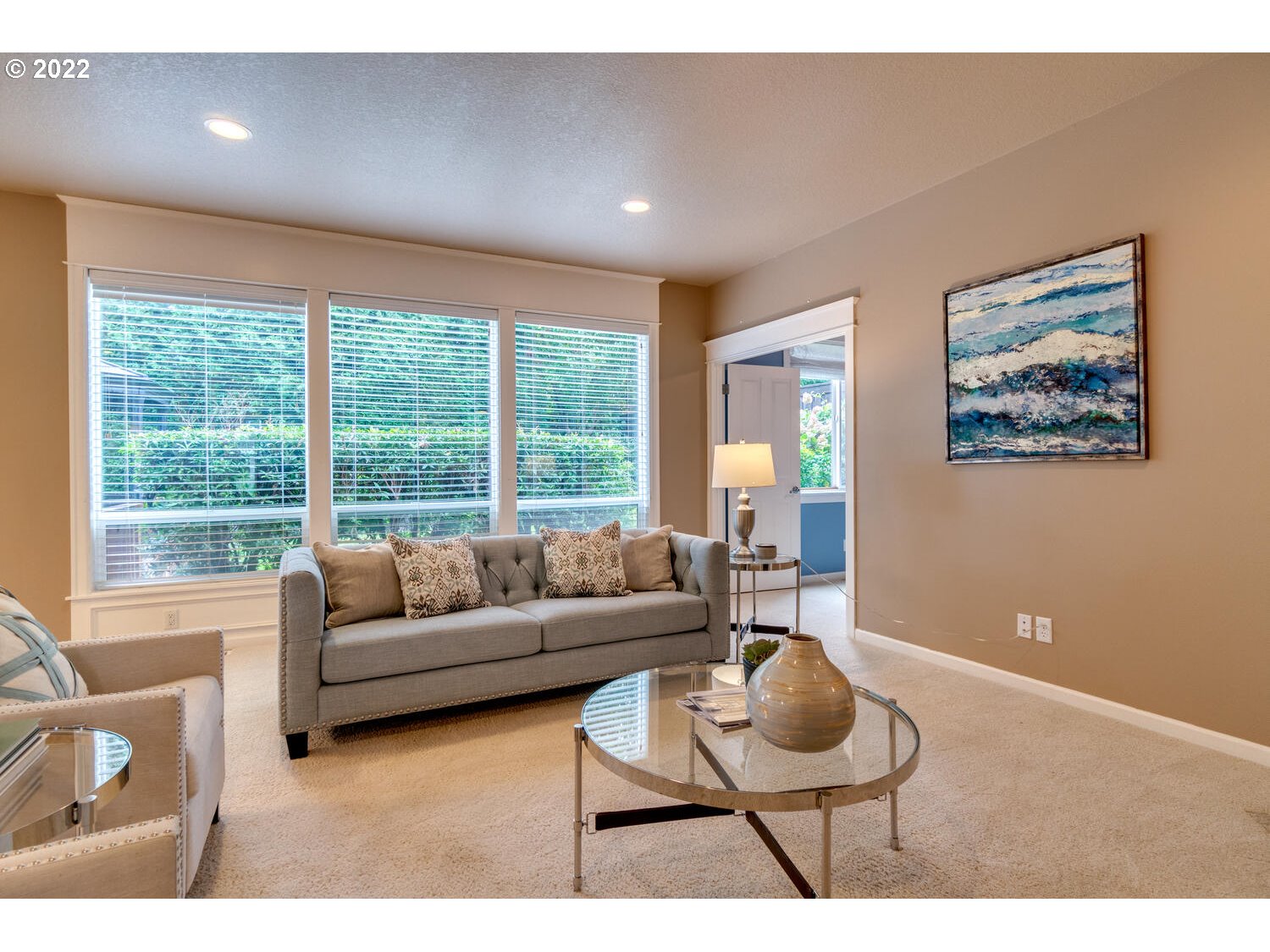 17496 Southwest 105th Avenue Tualatin, OR 97062 - Photo 8 of 28 a living room with furniture and a floor to ceiling window