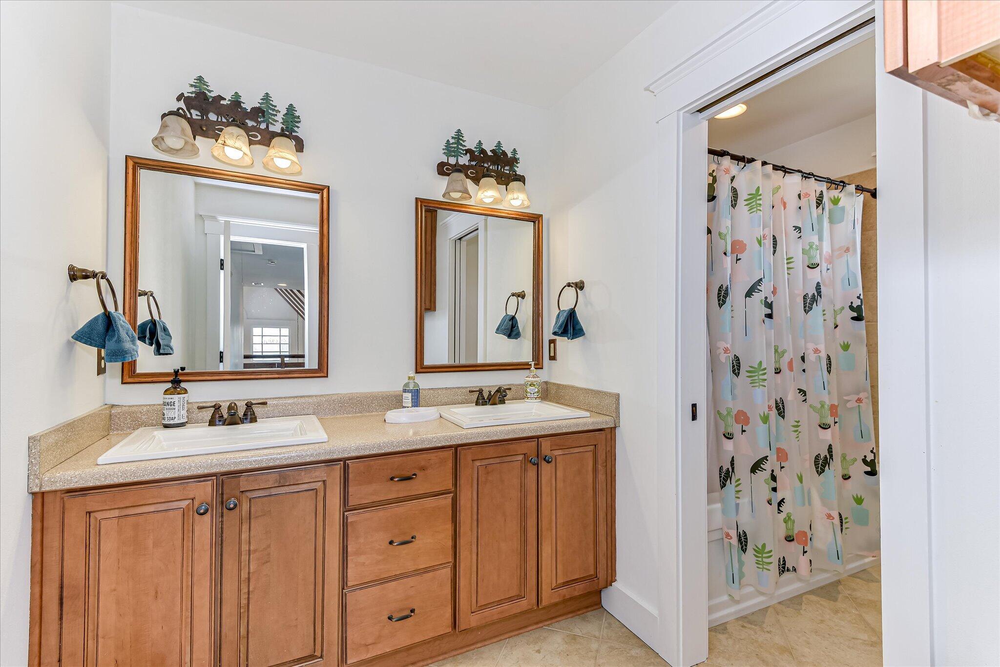 1063 Colbert Bridge Road Aiken, SC 29803 - Photo 20 of 68 a bathroom with double sink and a mirror