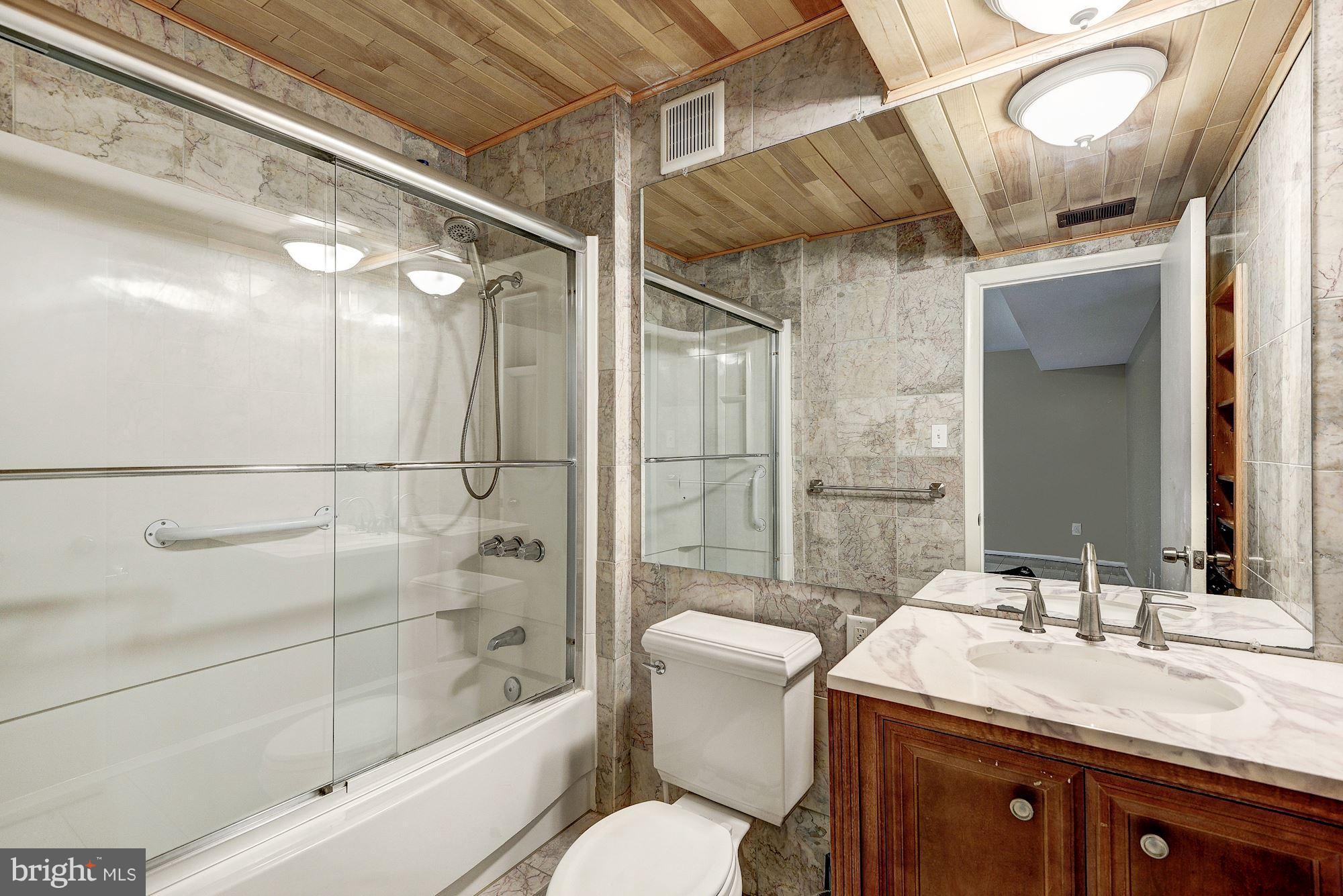 11324 Links Court Reston, VA 20190 - Photo 24 of 29 Inlaw's Shower Bth w/Custom Tile and Woodwork