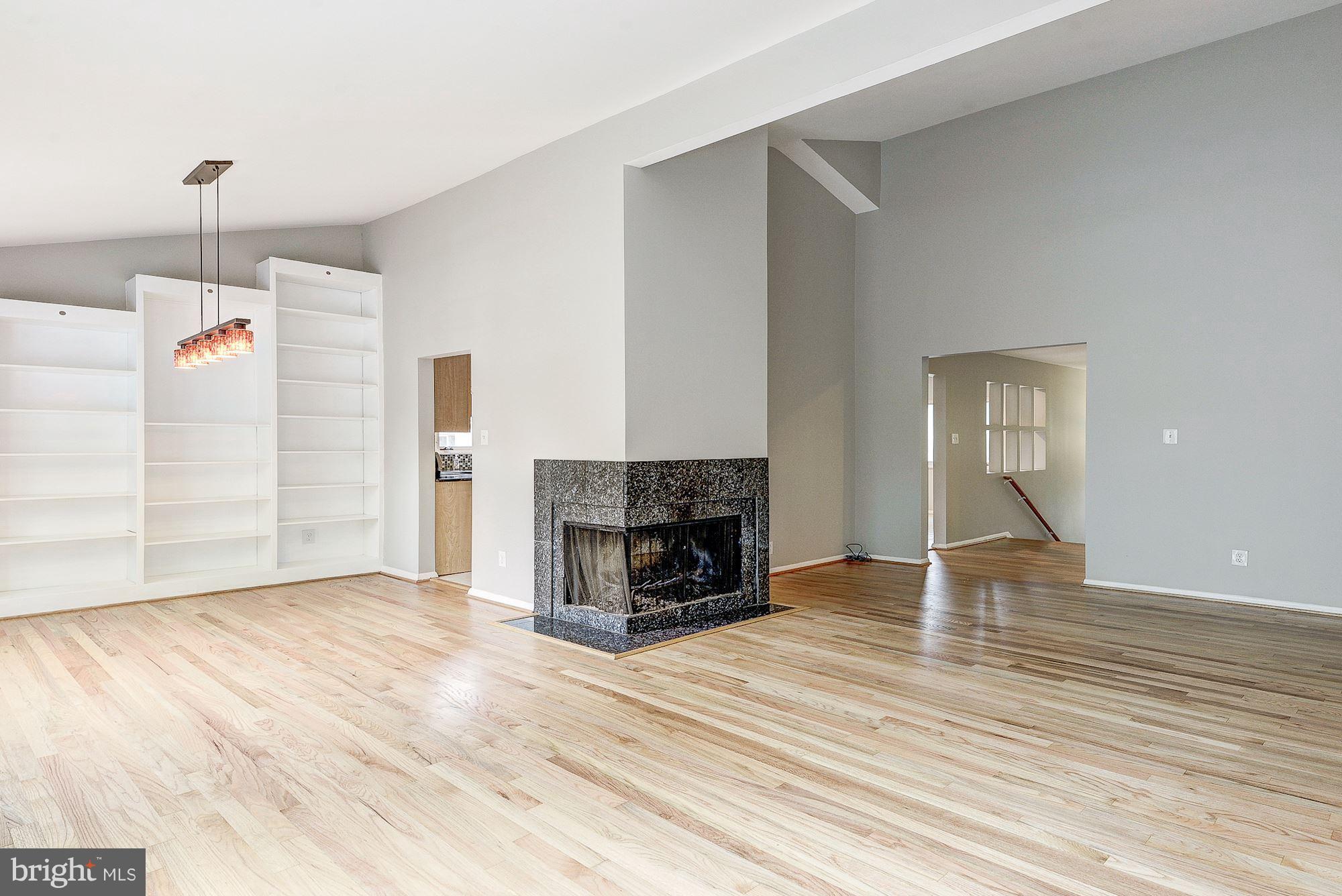Dining Room with Built-In Bookshelves off Kitchen