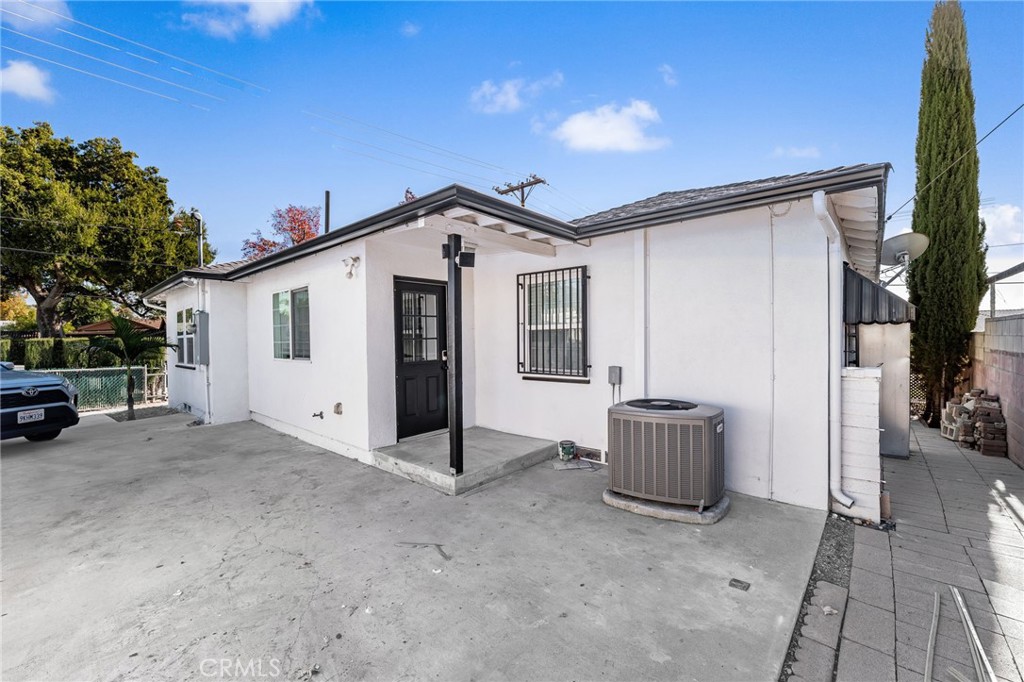 587 East Arrow Highway Upland, CA 91786 - Photo 17 of 17 a view of an house with backyard and a tree