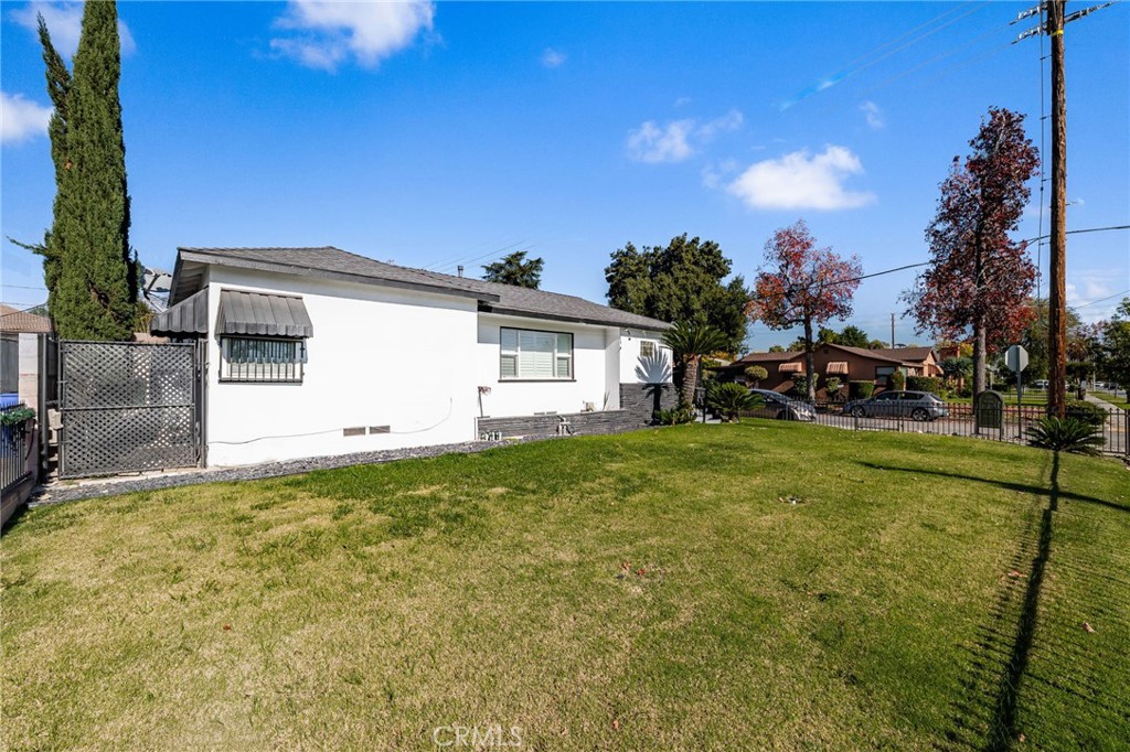 587 East Arrow Highway Upland, CA 91786 - Photo 3 of 17 a view of a house with backyard and garden