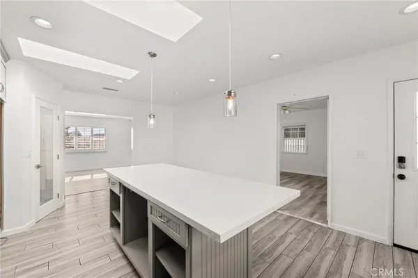 a kitchen with a table and chairs