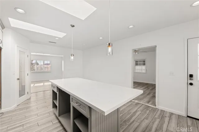a kitchen with a table and chairs