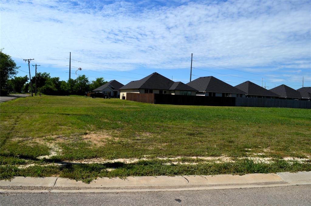 303 Preston Road Mabank, TX 75147 - Photo 3 of 5 a front view of a house with a yard and garage