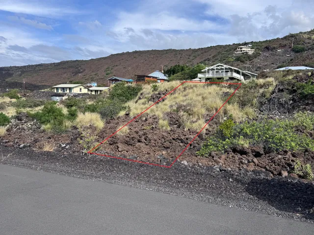 a view of a town with mountains in the background