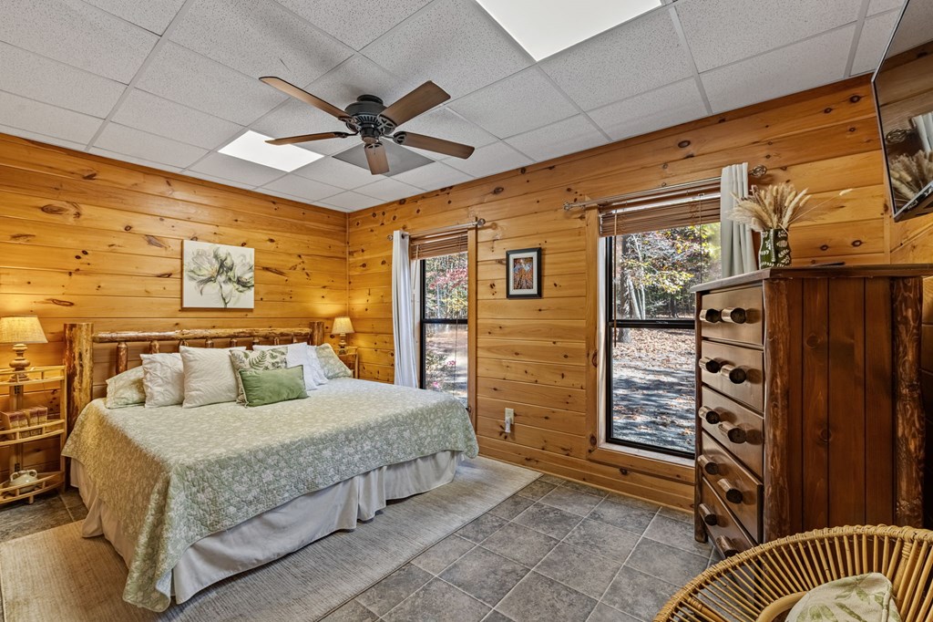 196 Ethan Wilson Way Morganton, GA 30560 - Photo 21 of 66 a bedroom with a bed and a walk in closet