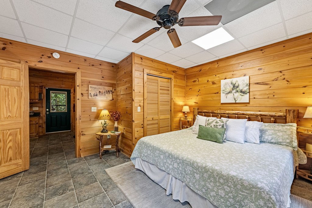 196 Ethan Wilson Way Morganton, GA 30560 - Photo 23 of 66 a bedroom with a bed and a mirror