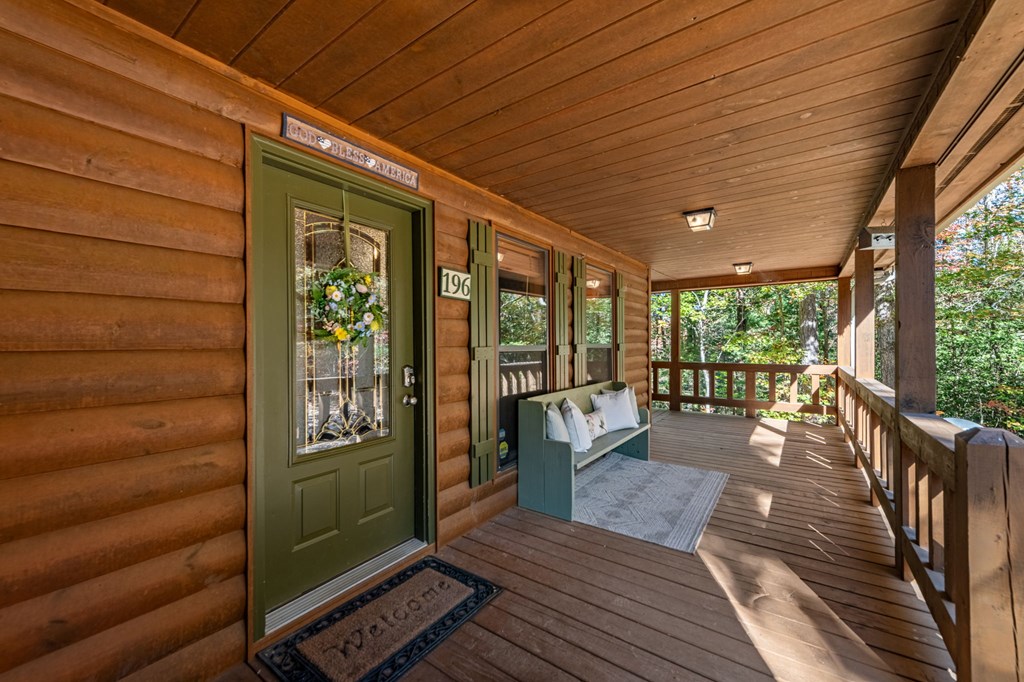 196 Ethan Wilson Way Morganton, GA 30560 - Photo 28 of 66 a roof deck with wooden floor and furniture
