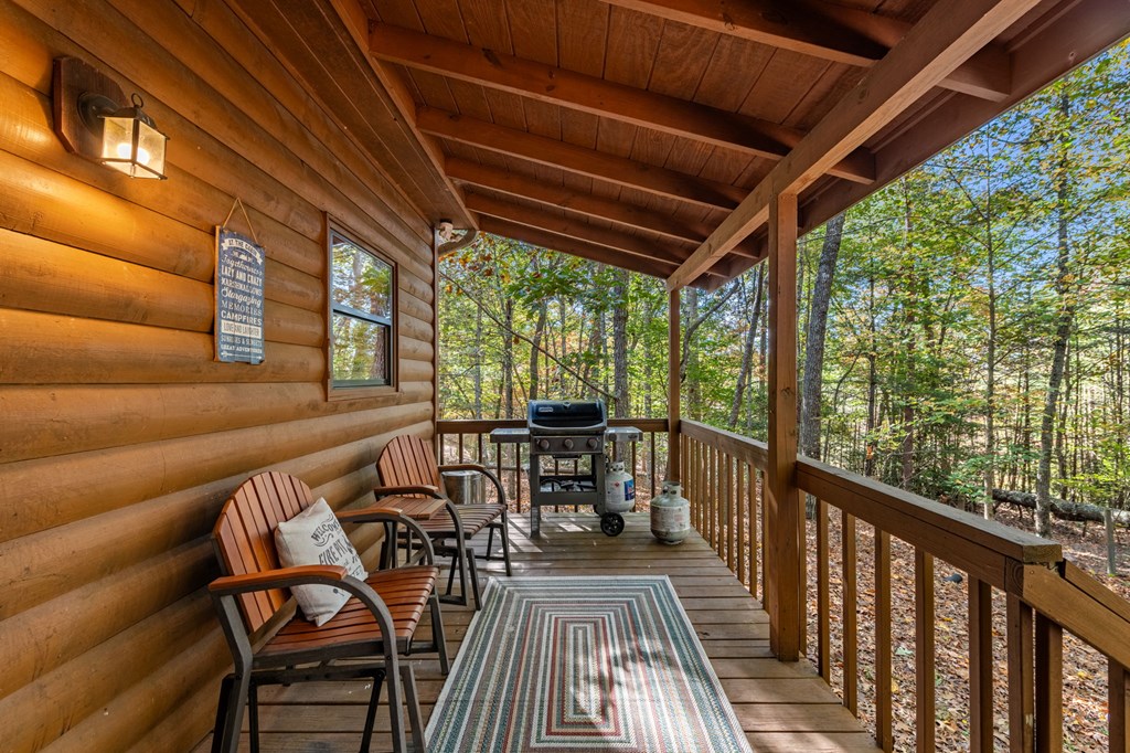 196 Ethan Wilson Way Morganton, GA 30560 - Photo 36 of 66 a view of a chairs and table in the balcony