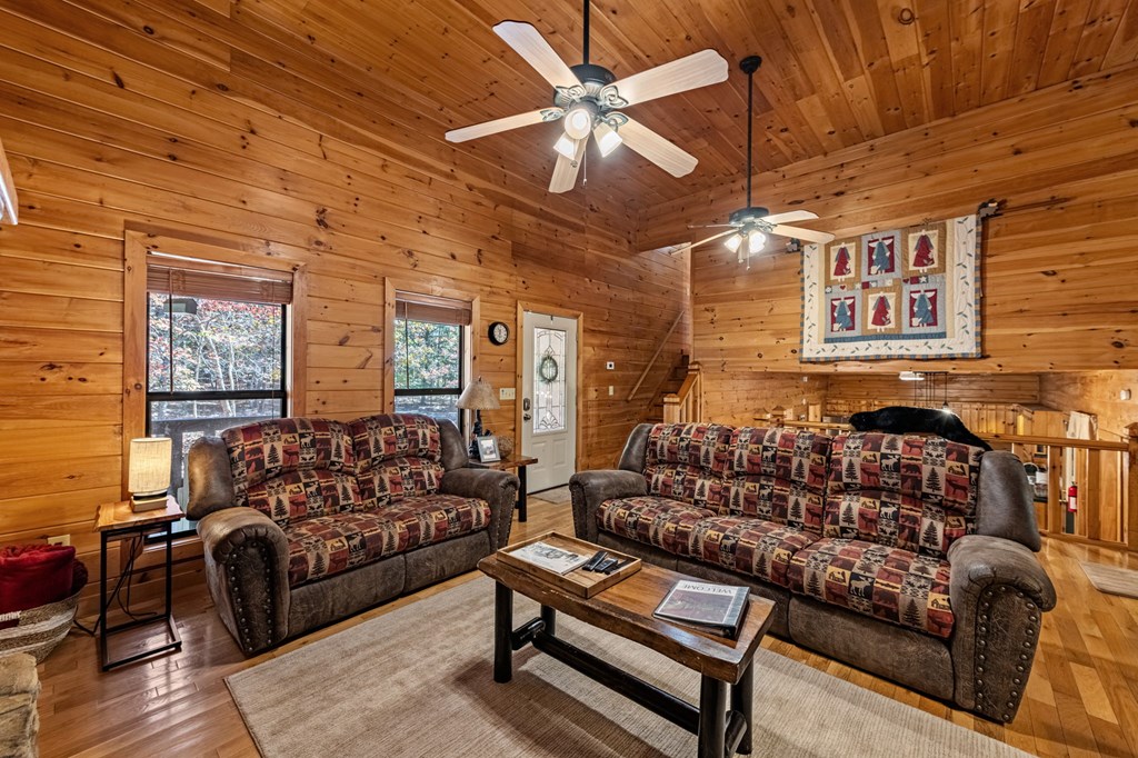 196 Ethan Wilson Way Morganton, GA 30560 - Photo 9 of 66 a living room with furniture a couch and a ceiling fan